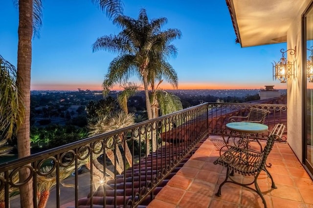 view of balcony at dusk