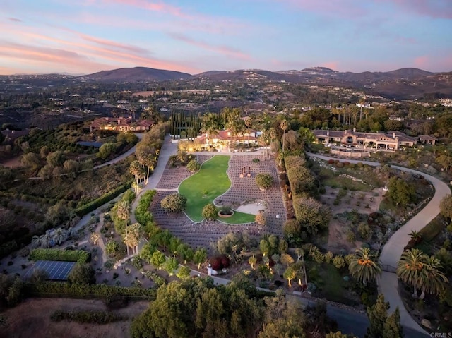 aerial view at dusk with a mountain view