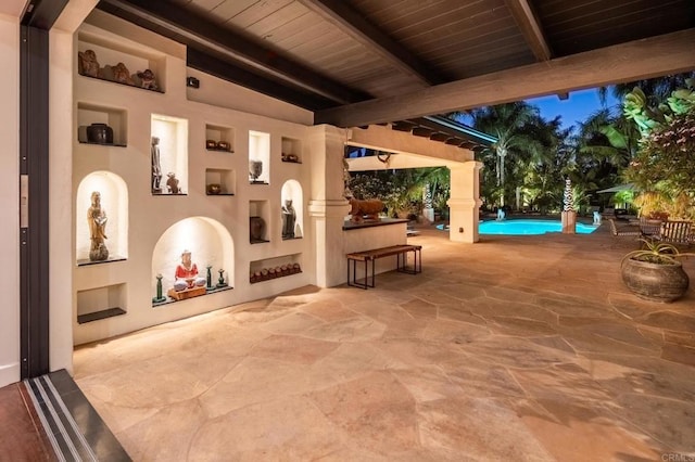 view of patio terrace at dusk