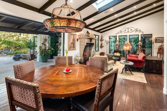 dining room featuring a fireplace, dark wood finished floors, lofted ceiling with beams, and recessed lighting
