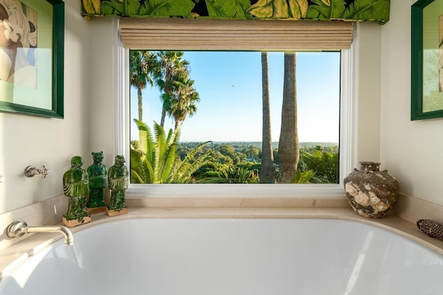 full bath featuring a tub to relax in