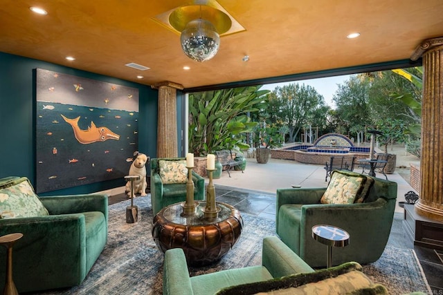 exterior space with recessed lighting, visible vents, and decorative columns