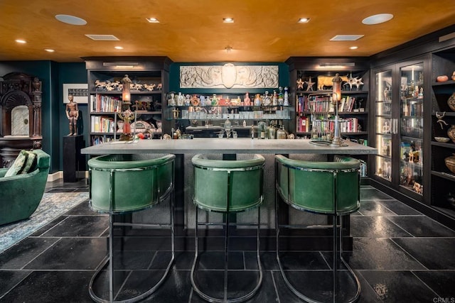 bar featuring a community bar, visible vents, and recessed lighting