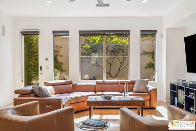 sunroom / solarium with ceiling fan