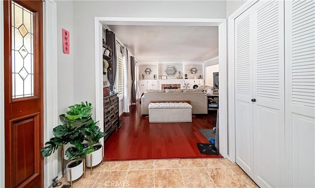 hall with light tile patterned flooring