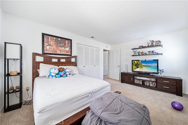 carpeted bedroom featuring a closet