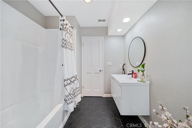 bathroom featuring tile patterned floors, shower / tub combo with curtain, and vanity