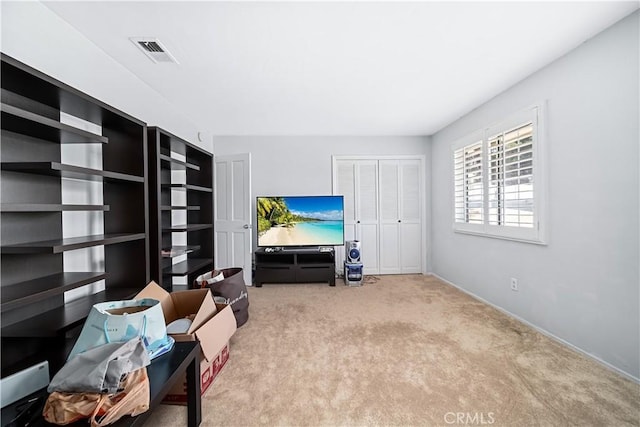 living area with light carpet