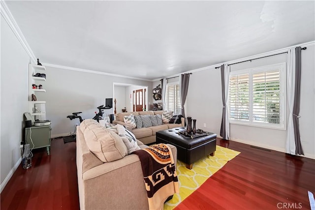 living room featuring dark hardwood / wood-style floors and crown molding