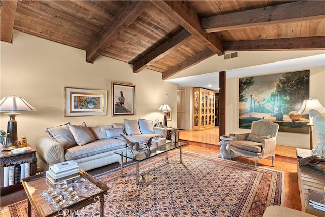 living room with vaulted ceiling with beams, hardwood / wood-style floors, and wooden ceiling