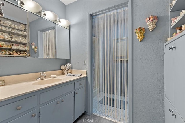 bathroom featuring vanity and a shower with shower curtain