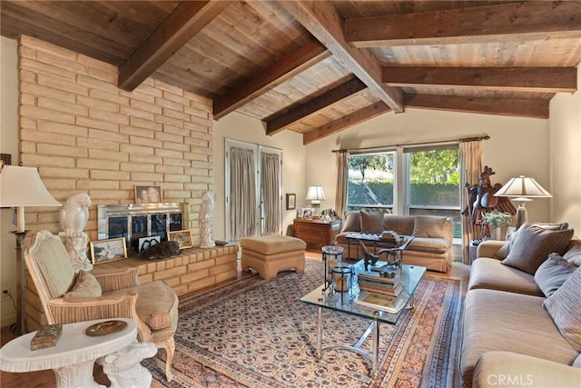 living room featuring lofted ceiling with beams, wood ceiling, and a fireplace