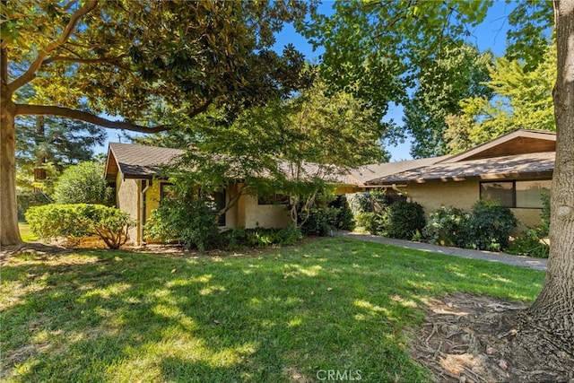 exterior space with a front lawn