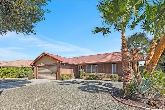 single story home featuring a garage