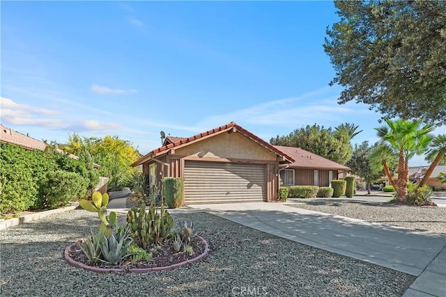 ranch-style house featuring a garage