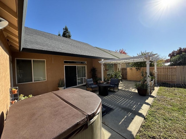 view of patio / terrace with a hot tub