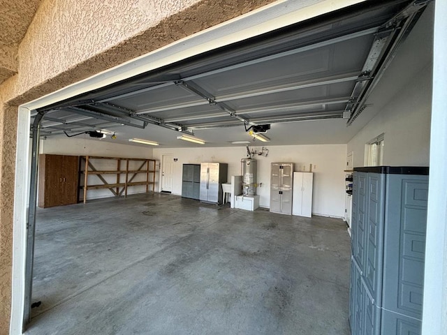 garage with gas water heater and a garage door opener