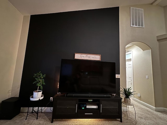 living room with baseboard heating and carpet