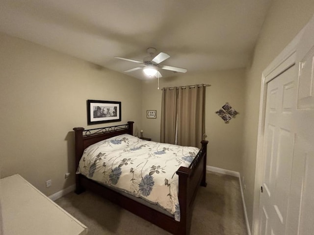 bedroom featuring dark colored carpet and ceiling fan