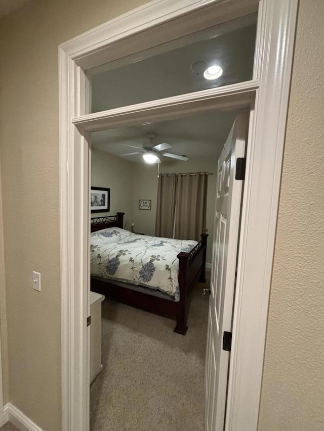 carpeted bedroom featuring ceiling fan