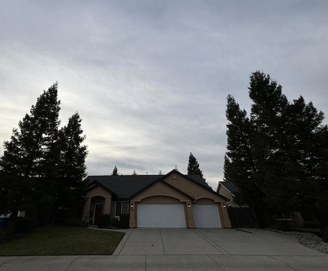 view of front facade with a front yard and a garage