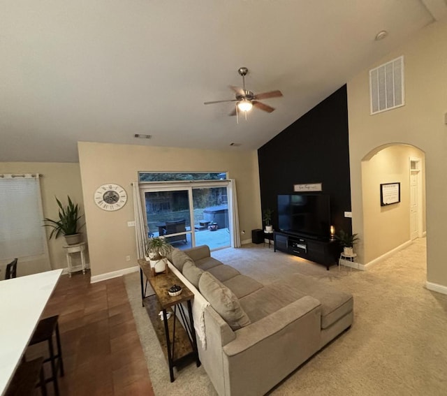 living room with ceiling fan and lofted ceiling