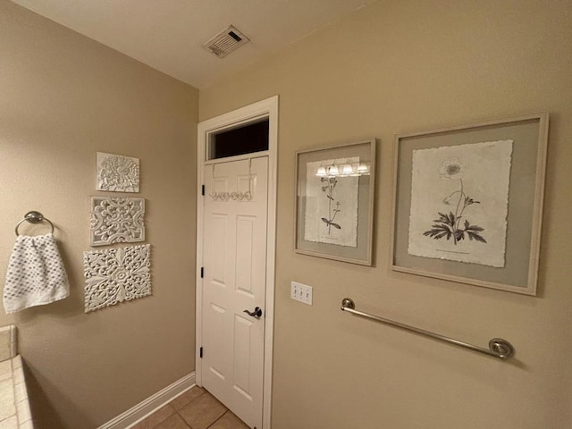 doorway to outside featuring tile patterned flooring