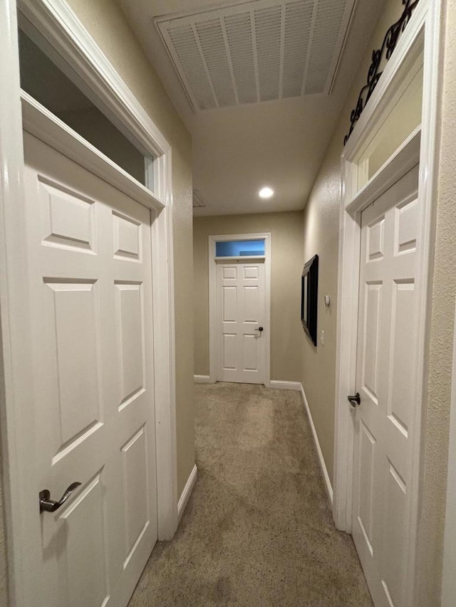 hallway featuring carpet flooring