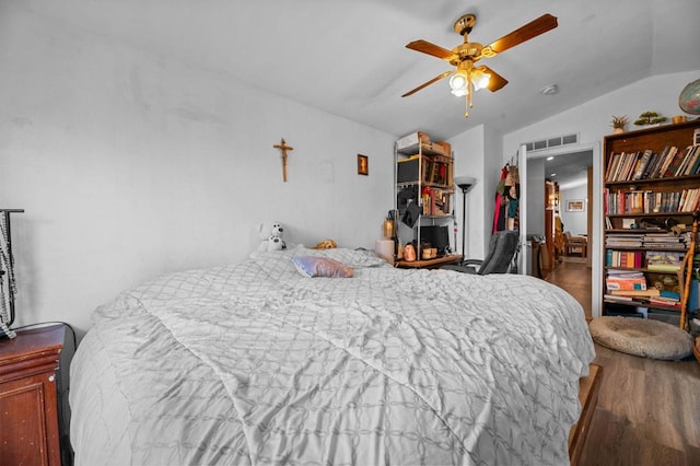 bedroom featuring wood-type flooring, ceiling fan, and lofted ceiling