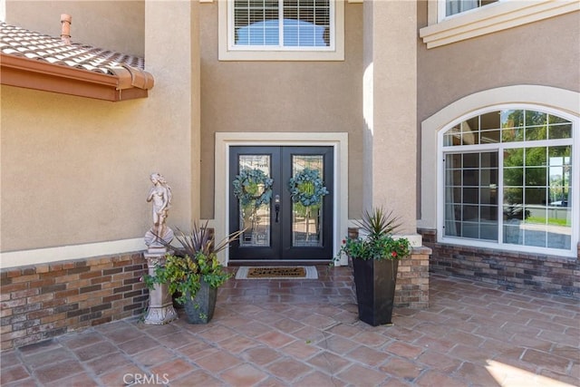 entrance to property featuring french doors