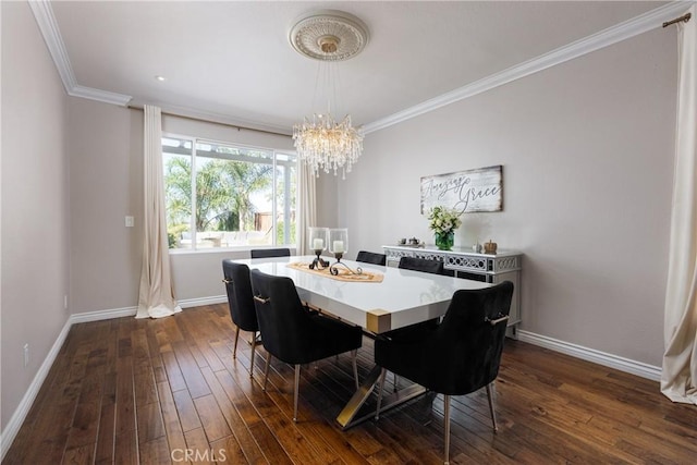 dining space featuring dark wood-type flooring, an inviting chandelier, and ornamental molding