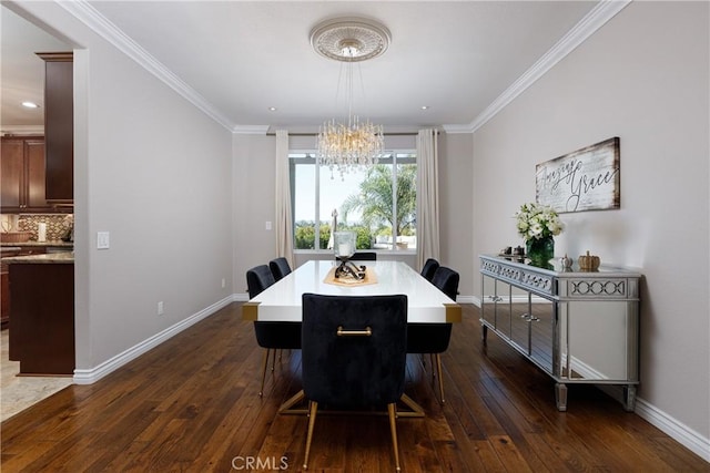 dining area featuring a chandelier, dark hardwood / wood-style flooring, and ornamental molding