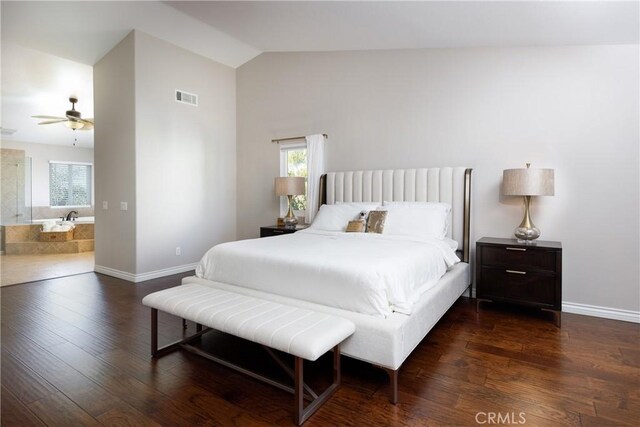 bedroom featuring ceiling fan, dark hardwood / wood-style floors, multiple windows, and lofted ceiling