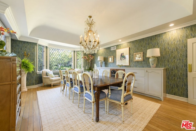 dining room with a chandelier and light wood-type flooring