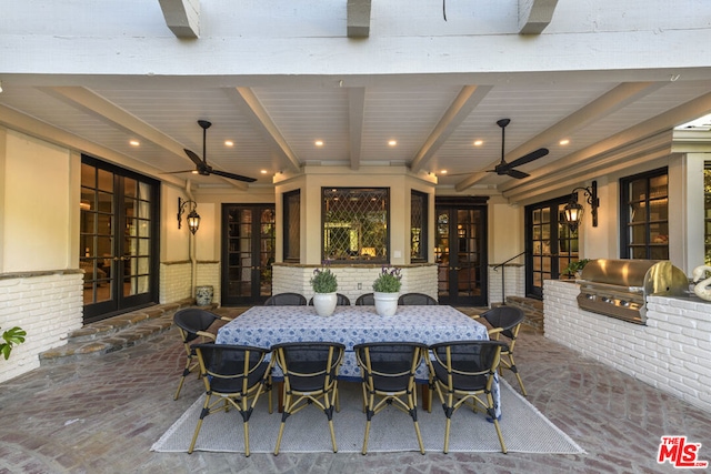 view of patio / terrace featuring an outdoor kitchen, a grill, and french doors