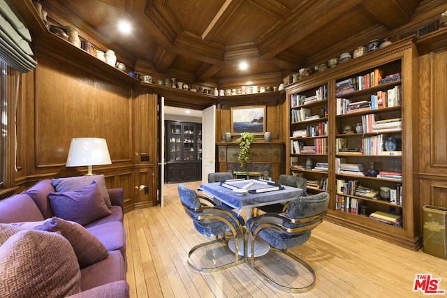 interior space featuring wooden ceiling, light hardwood / wood-style flooring, built in features, crown molding, and wood walls