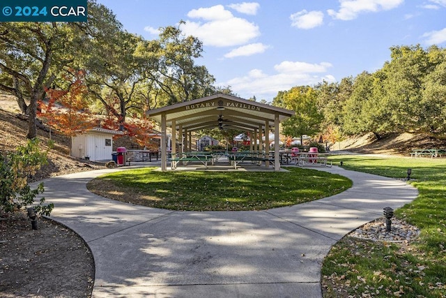 view of community with a gazebo, a yard, and a shed