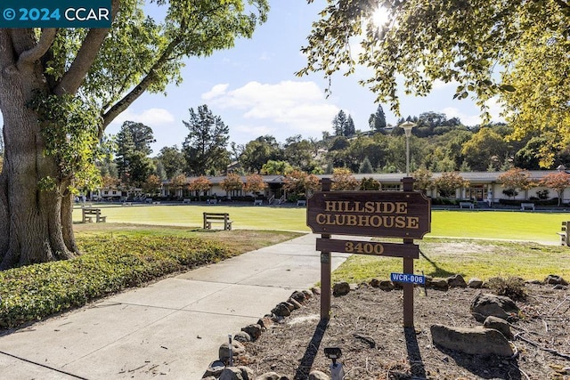 view of property's community with a lawn