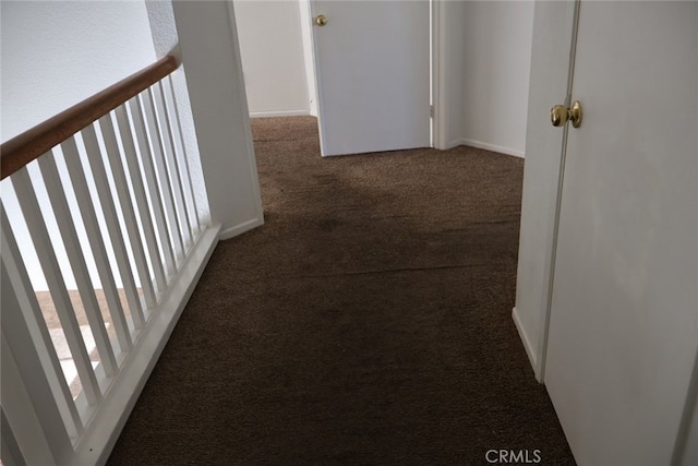 hallway featuring carpet flooring