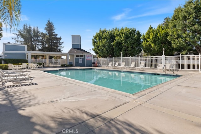 view of swimming pool with a patio