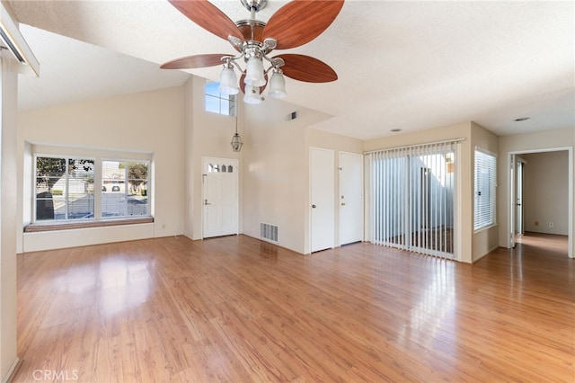 unfurnished living room featuring hardwood / wood-style floors, a textured ceiling, and ceiling fan