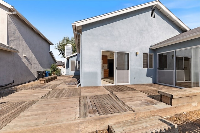 back of property featuring a wooden deck