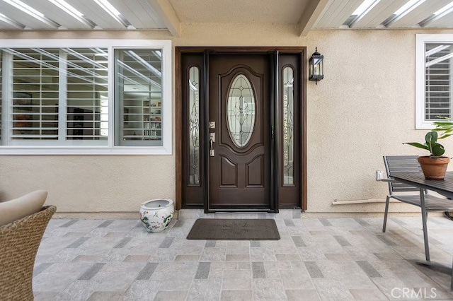 property entrance with covered porch