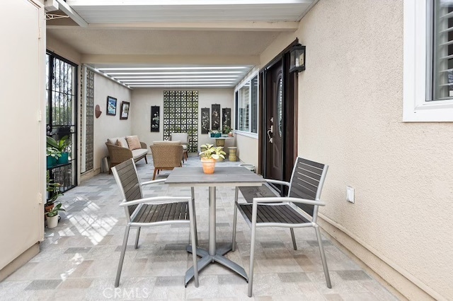 sunroom / solarium with beamed ceiling