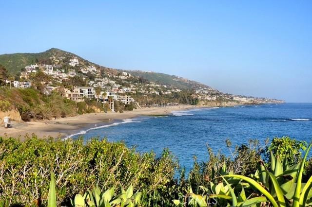 view of water feature featuring a view of the beach and a mountain view