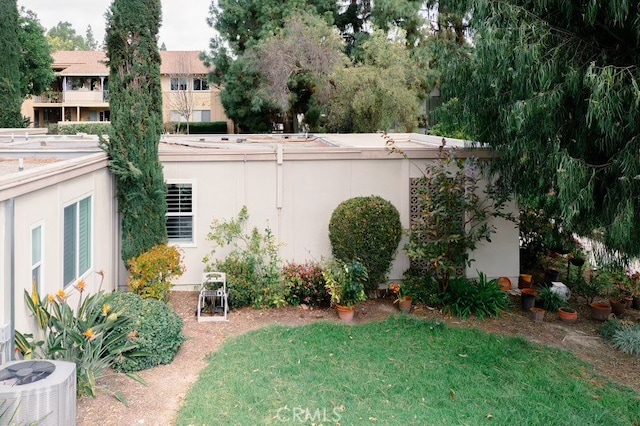 view of yard featuring central air condition unit