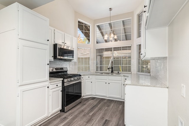 kitchen with white cabinets, stainless steel appliances, and sink