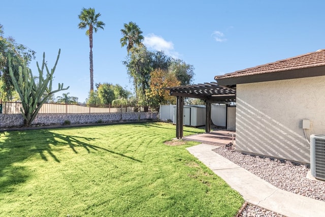 view of yard featuring central AC unit and a storage shed