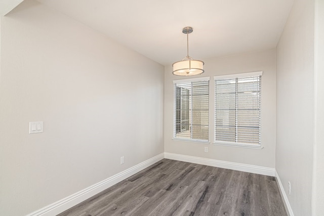 empty room featuring dark hardwood / wood-style flooring