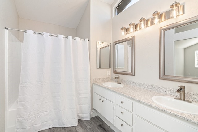 bathroom featuring hardwood / wood-style floors and vanity